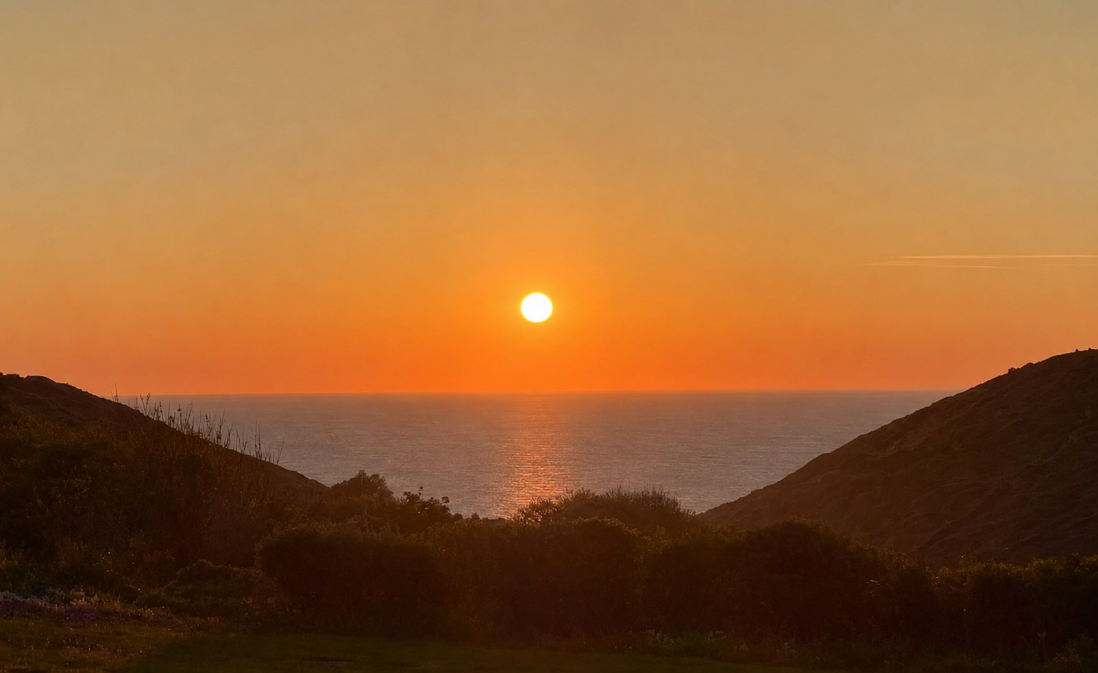 Sunset over the sea at Cot Valley, Cornwall